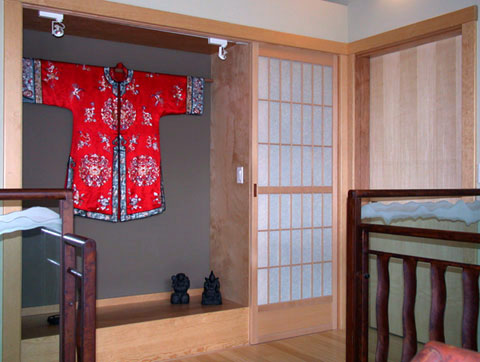 This shoji door covers a closet while remaining in harmony with the lovely silk robe in the tokonoma beside it.