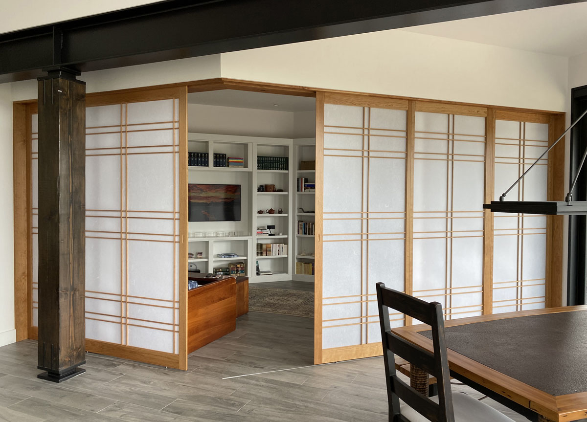 Custom Cherry shoji screens as room divider with fixed and sliding panels